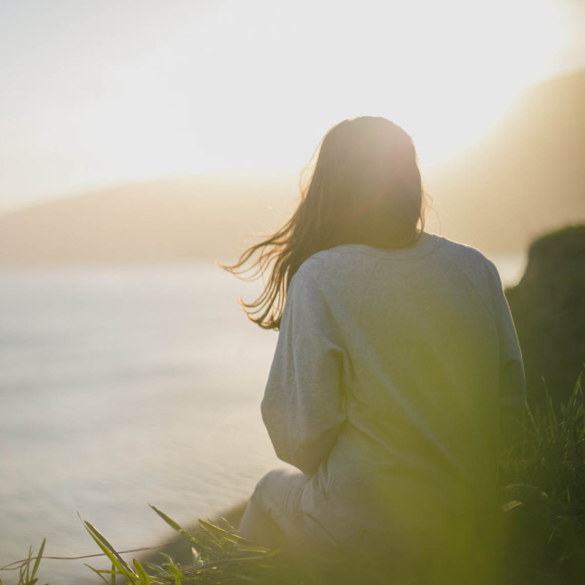 Photo of Woman Gazing out at the Ocean, by Artem Kovalev, Unsplash